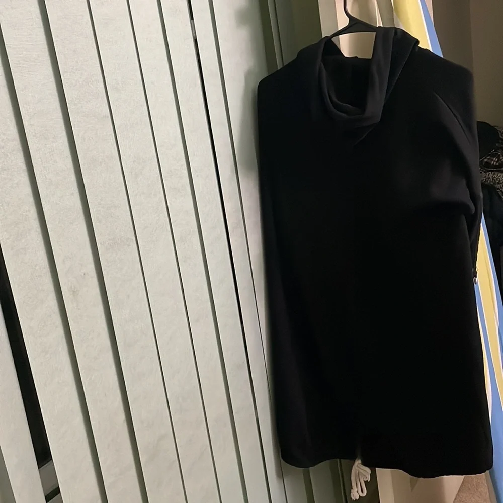 That is a sweatshirt. It is long and very black. - Picture 3 of 4